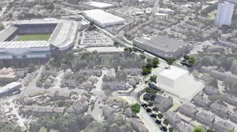 WMCA / Midland Metro Alliance A computer-generated image which is an aerial view of the project. It shows the large stadium to the left with "Blues" written on and there are other buildings nearby as well as pitches. The wider picture shows houses, trees car parks and other buildings.