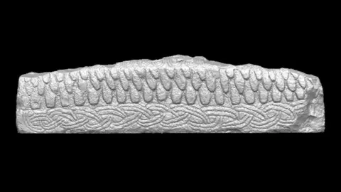 Museum of Liverpool The Hogback stone is a long rectangular shape with a scale-like pattern in the top half, and a weaving pattern in the bottom.