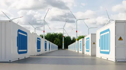 Getty Images Energy storage system with lithion-ion battery containers and wind turbines