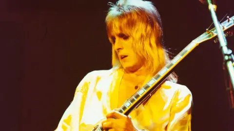 Mick Ronson playing guitar