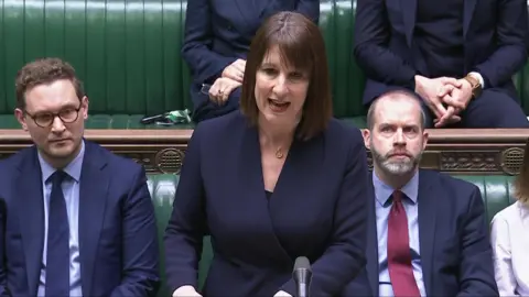 Rachel Reeves stands at the dispatch box speaking in the House of Commons, Westminster, answering questions from MP