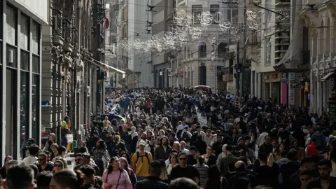 People walking down a street in Istabul