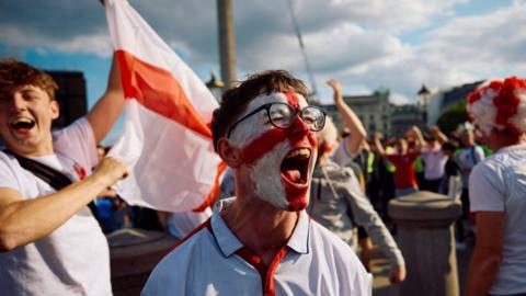 Fan screaming with face painted in England colours