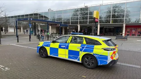 Richard Knights/BBC A police car outside Centre:MK during the day.