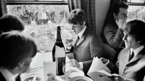 David Hurn / Magnum Photos The Beatles on a train 