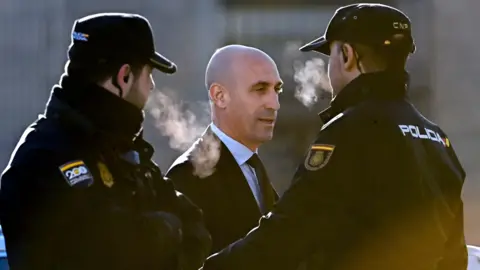 EPA Luis Rubiales stands between two police guards