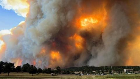Smoke rises from a wildfire in Ruidoso, New Mexico