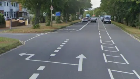 A street view image of Welford Road at the junction with Baldwin Road