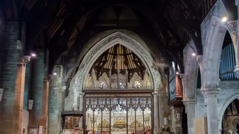 Jules & Jenny Ornate church building interior and stone columns and arches