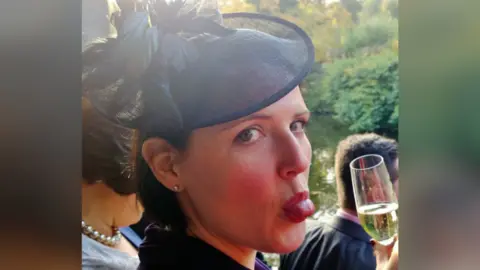 Supplied Dr Rachel Gibson sticking her tongue out at the camera during an event 