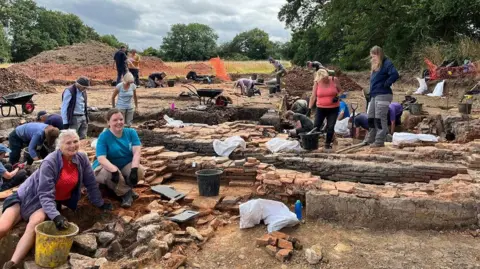 People digging at an excavation