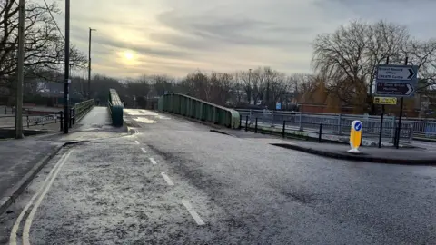 Bathurst Swing Bridge in the centre of Bristol open to traffic, although there are no vehicles visible