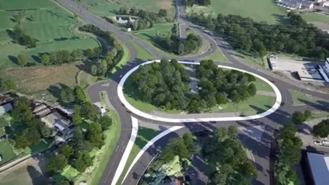 Highways England An artists' impression of a roundabout surrounded by green shrubbery and buildings.