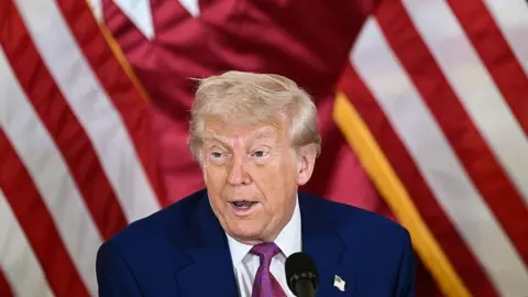 US President Donald Trump attends a breakfast with business leaders in Doha on May 15, 2025. 