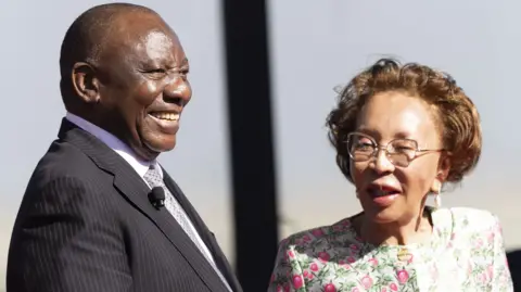 EPA Cyril Ramaphosa stands next to his wife Tshepo Motsepe at the Union Buildings in Pretoria 