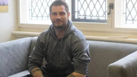 Light Project Peterborough Tony sitting on the sofa 