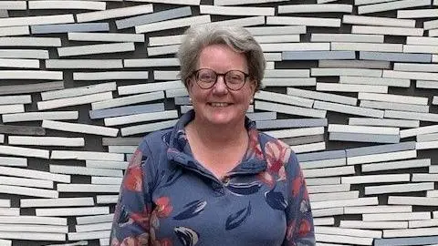 Bristol University Diabetes and Metabolism Team Professor Kathleen Gillespie, team leader, standing up and smiling at the camera