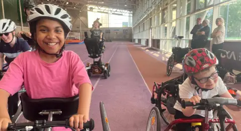 Two children on running with frames 