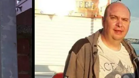 FAMILY HANDOUT Raymond Groves looking into the camera wearing a dark jacket and grey T-shirt