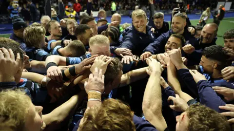 Cardiff players in a huddle