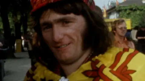 A Scotland fan in Dortmund in 1974 wearing a royal banner and tartan bunnet.