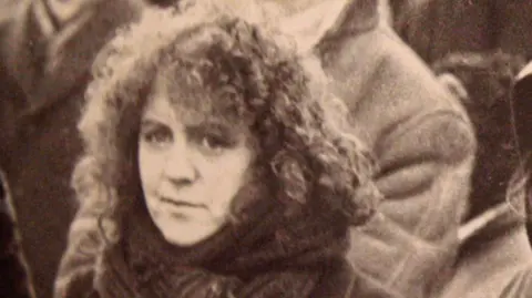 Black and white archive photo of Nell McCafferty as a young woman