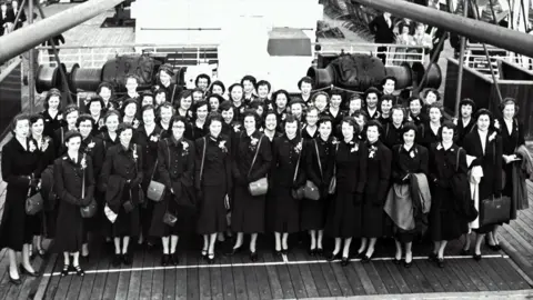 PA Media A picture of 50 Canadian teenagers on board ship travelling to the 1953 Coronation