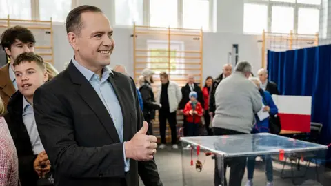 Getty Images Karol Nawrocki, a non-partisan Presidential candidate supported by the right wing Law and Justice Party casting his vote during the presidential election on May 18, 2025 in Gdansk, Poland