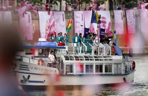  Hamad I Mohammed/Reuters Athletes of Bolivia, Bosnia-Herzegovina and Botswana aboard a boat in the floating parade on the River Seine during the opening ceremony