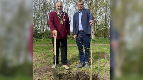 Council Chairman, Councillor Mike Clarke and Chief Executive Ian Fytche plant first of commemorative trees