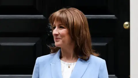 Rachel Reeves pictured outside No 11 Downing Street, wearing a light blue suit