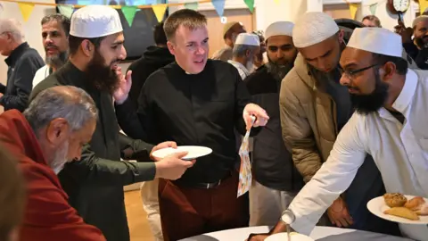 Clive Lawrence for Blackburn Diocese Members of the church and mosques cricket teams 