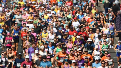 Crowds take part in a marathon.