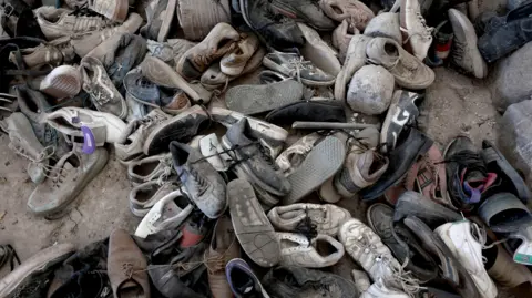 Getty Images Shoes and other belongings have been found at the site of three alleged clandestine crematoriums 