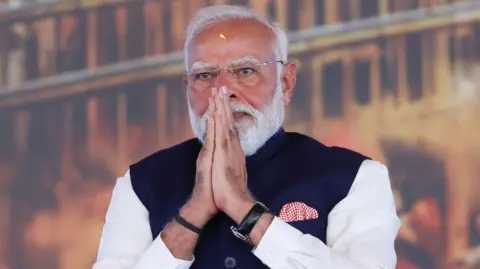 India's Prime Minister Narendra Modi is seen joining his hands in a greeting at a recent event in Kolkata in West Bengal on May 9, 2026. REUTERS/Sahiba Chawdhary