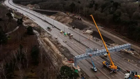 Getty Images A crane on the M25 the last time road was closed, with no traffic on the road