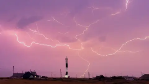 BBC Weather Watchers / KentGardener Lightning sparks from the sky over Dungeness lighthouse