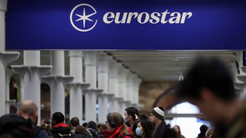Passengers queue at the departure gates of the Eurostar terminal at St Pancras International Station, as services resume following Thursday's strike at the Eurotunnel, in London, Britain, December 22, 2023. 