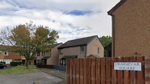 A Google street view image of some modern houses with a sign saying Craigievar Square