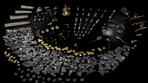 Amgueddfa Cymru A picture of the artefacts line out, including gold and silver coins