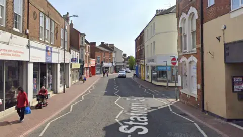 Station street has an array of shops and premises on either side of the road.