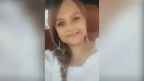 Leicestershire Police A selfie of Tarneet Riaz, smiling and wearing a white top with a plait in her hair
