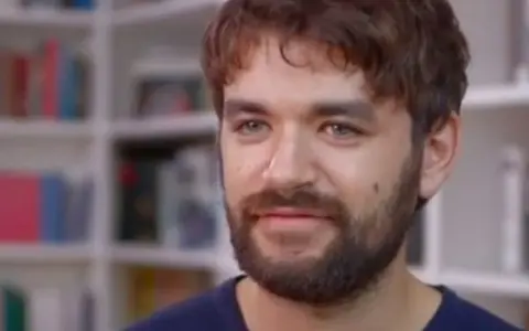 A screenshot from a film invterviewing Liron Vellemen