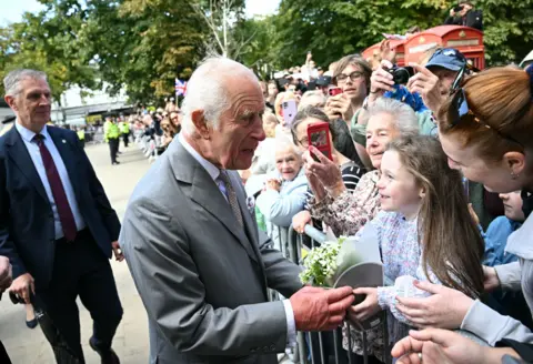 King Charles greeting people in Southport