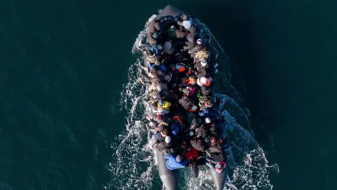 EPA-EFE/REX/Shutterstock An aerial shot of a crowded boat crossing the English Channel.