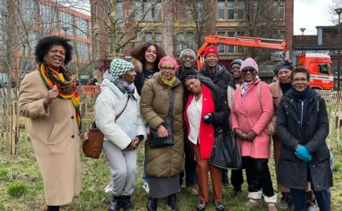 Legacy Makers members at the site of the new statue