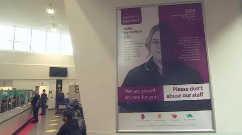 A poster saying 'please don't abuse our staff' in the Emergency Department of Leicester Royal Infirmary