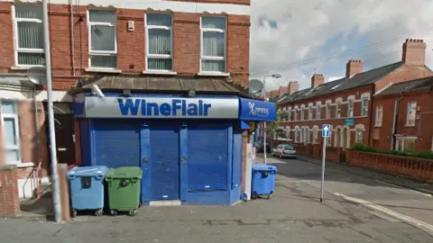 Google Maps A Google Maps screenshot of a WineFlair in Agincourt Avenue in south Belfast. It shows a blue and silver building near a red-brick terrace houses.