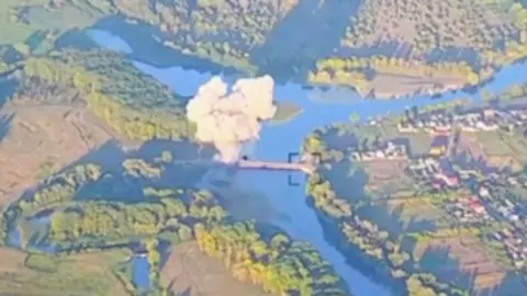 Ukrainian Armed Forces Screenshot of aerial footage showing a strike on a Russian bridge