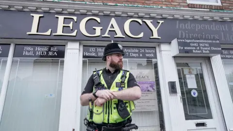 Police outside the Beckside branch of Legacy Independent Funeral Directors in Hull after after reports of "concern for care of the deceased". March 9, 2024